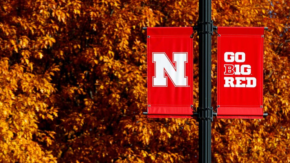 campus flag pole with N Go Big Red flags